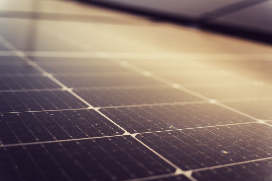 Sun shining brightly over freshly installed solar panels